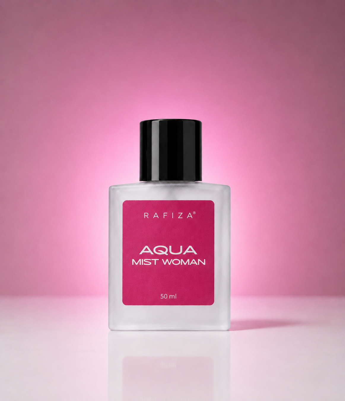 A 50ml bottle of Rafiza Aqua Mist Woman perfume, featuring a clear glass bottle with a black cap and a vibrant magenta-pink label, set against a matching pink gradient background.
